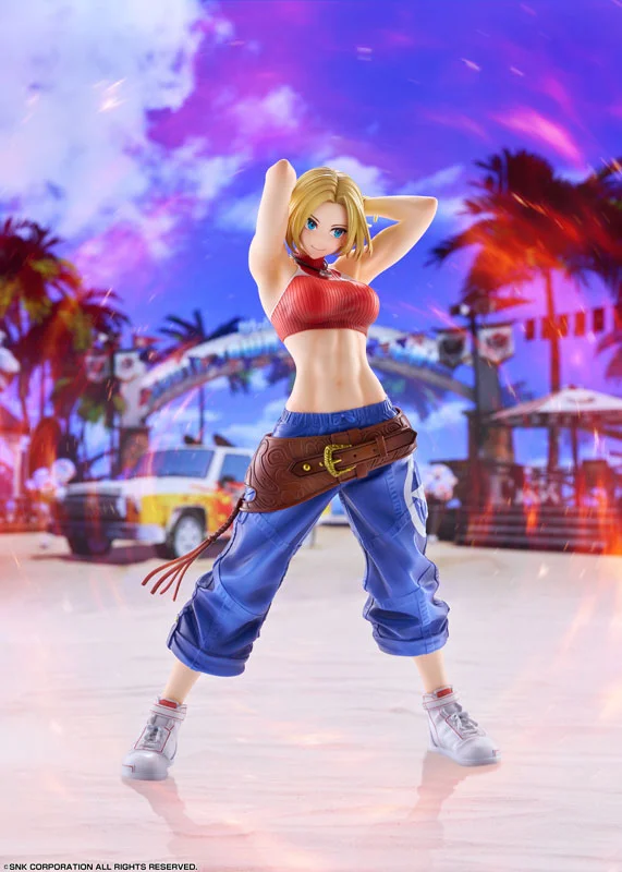 Figurka kolekcjonerska Blue Mary z The King of Fighters XV w pełnej okazjonalnej pozie na tle plaży.